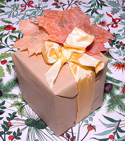 a packet with autumn leaves and a silk ribbon