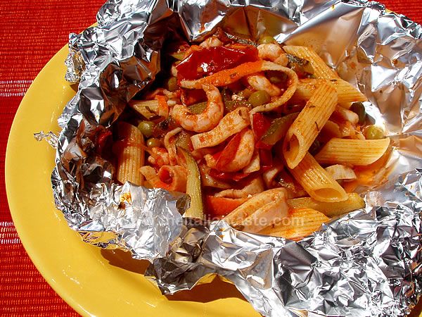Penne with fish and vegetable sauce in foil