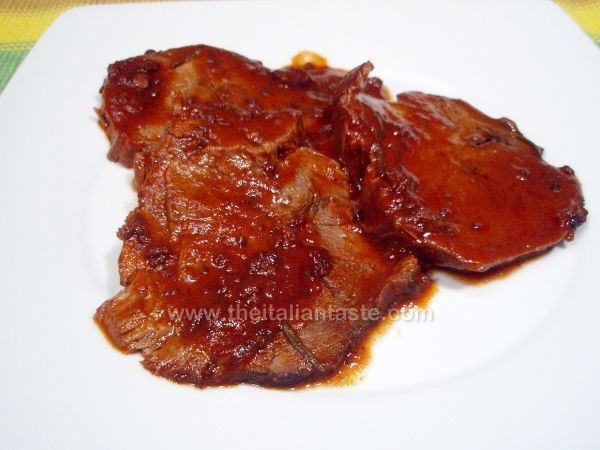 Pot roast beef cooked in tomato sauce
