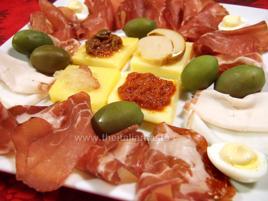Antipasto platter with cold cuts and canapes
